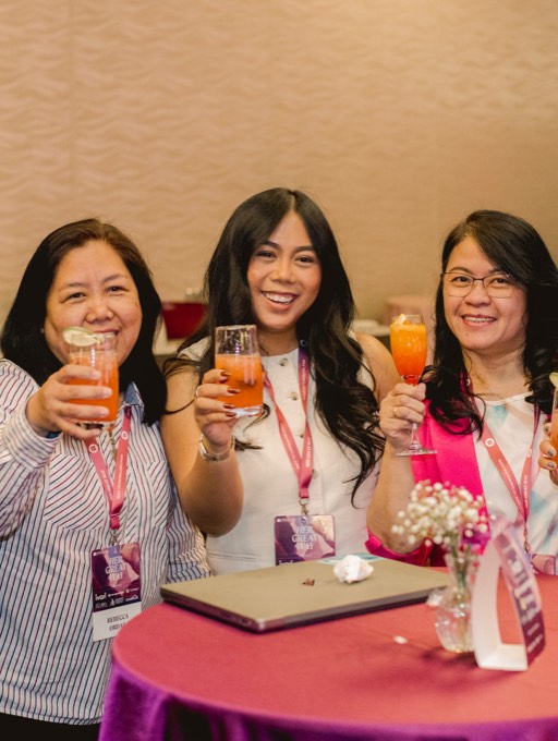 Three women smiling with handcrafted Club Citrine mocktails
