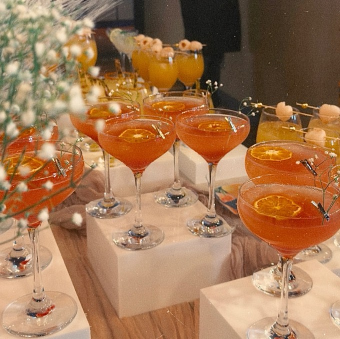 Club Citrine event bar menu with a row of garnished mocktails
